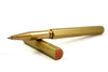 Y Studio Classic Revolve rollerball pen in brass with sleek design and polished finish, showcasing its elegant writing instrument features.