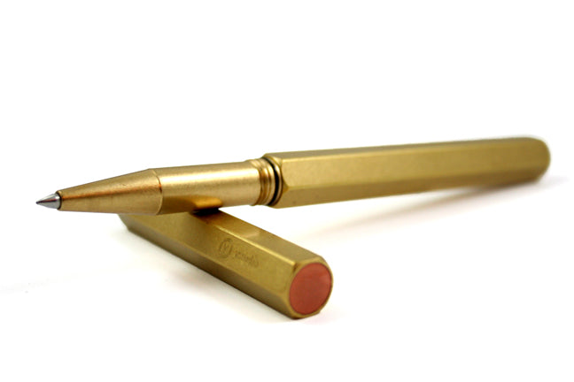 Y Studio Classic Revolve rollerball pen in brass with sleek design and polished finish, showcasing its elegant writing instrument features.