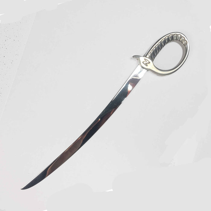 Pewter letter opener by Le Potier D'Étain with intricate design and polished finish, ideal for opening envelopes.