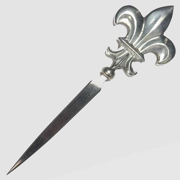 Le Potier D'Étain pewter letter opener with intricate design, showcasing a sleek, elegant tool for opening envelopes.