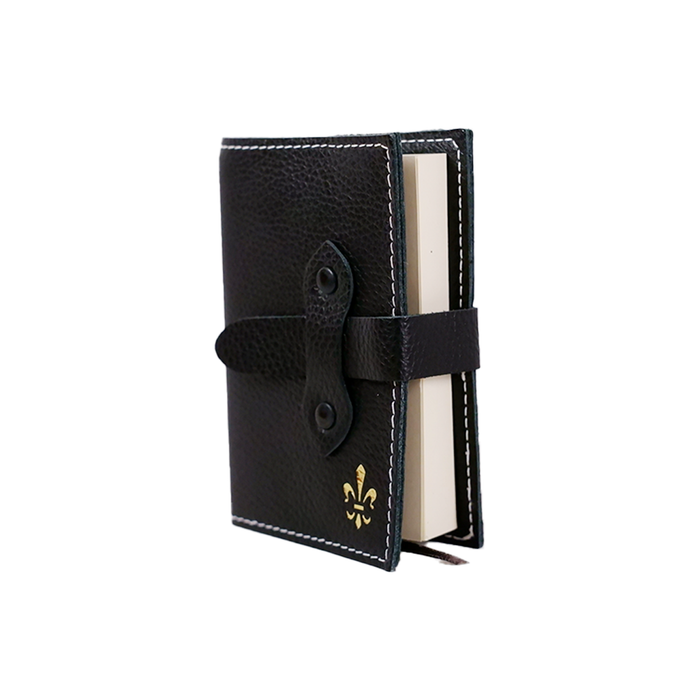 Large black Italian leather refillable latch journal or 2025 planner by Il Cartiglio, open to pages with handwritten notes.