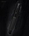 Pelikan Souverän M809 black matte fountain pen with gold accents and textured grip section.