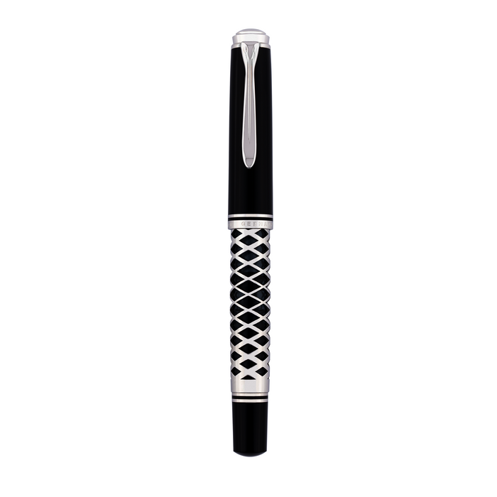 Pelikan Souverän M805 fountain pen with metal sleeve, featuring a gold nib and sleek black body for elegant writing.