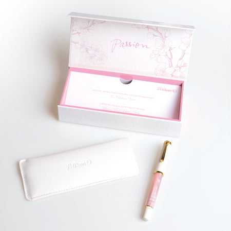 Pelikan M200 Cherry Blossom fountain pen with pink lacquer finish and gold accents, displayed on a white background.