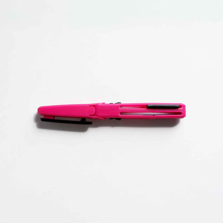 Pink KUM pocket scissors with compact design and sharp blades, ideal for precise cutting and on-the-go use.