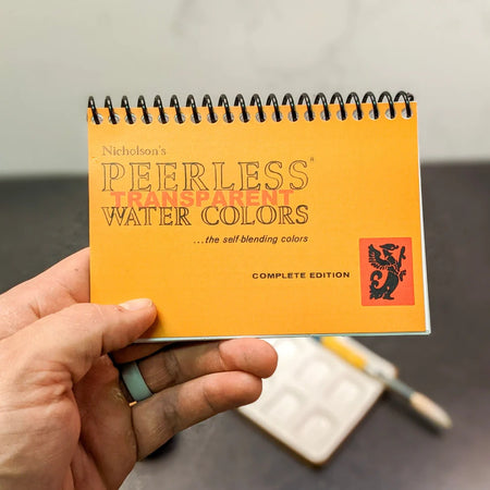Peerless Watercolors Mini Complete Edition set of watercolor paints with compact case and vibrant color selection.