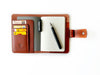 A6 leather journal cover in English tan by Eng Leather Co., featuring smooth leather with subtle stitching details.