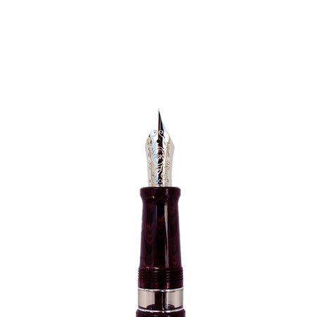 Aurora Ebonite Magenta fountain pen with sleek design and gold accents, showcasing the pen's vibrant color and elegant craftsmanship.
