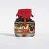 Papier Plume Bûche de Noël shimmer fountain pen ink in a glass bottle with festive packaging and gold accents.