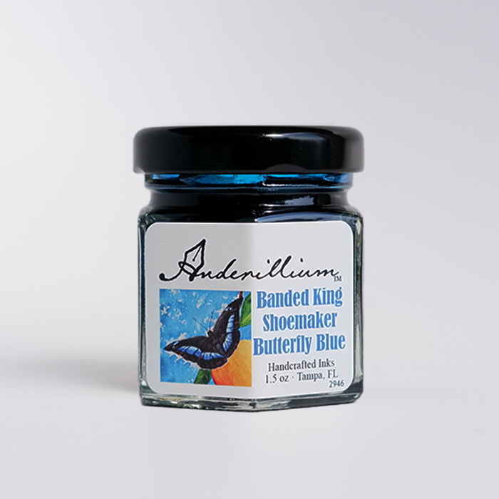 Anderillium Banded King Shoemaker Butterfly Blue fountain pen ink in a glass bottle with a blue label and silver cap.