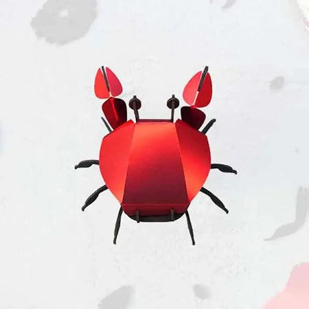 Colorful paper beach crab craft by Assembli, featuring vibrant paper textures and detailed crab design for creative projects.