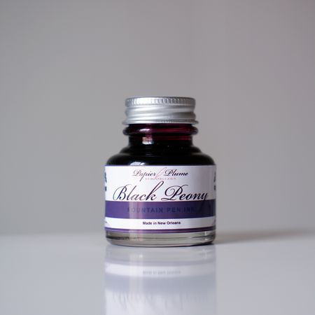 Papier Plume fountain pen ink set with 12 bottles of black peony ink, 30ml each, for writing and calligraphy.