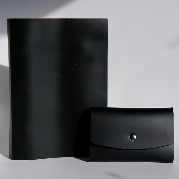 Black Papier Plume Swatch Book set with color samples and sample pages visible in the image.