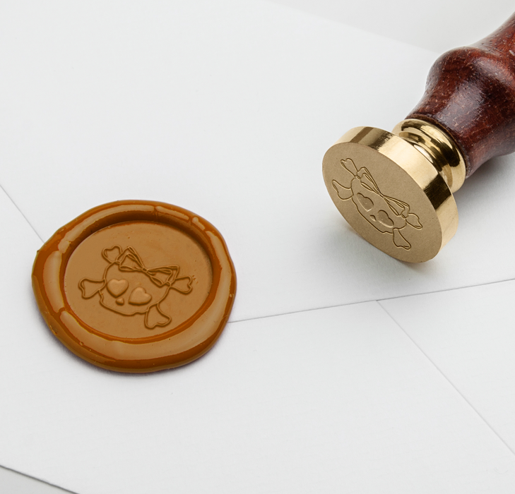 Papier Plume Halloween wax seal featuring a skull and bow design from Little Craft Fest
