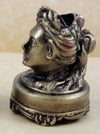 Bronze head-shaped pen rest by Le Potier D'etain, featuring intricate detailing for elegant desk organization.