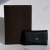 Swatch Books set by Papier Plume featuring a brown textured swatch book with fabric-like surface and color samples.