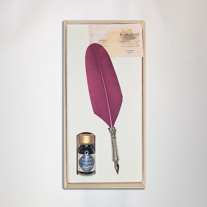 Bortoletti glass feather dipping pen set in burgundy, featuring elegant feather-shaped design and a matching glass ink holder.