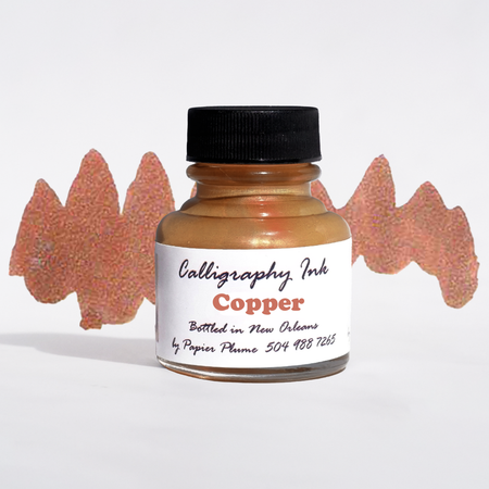 Bottled Papier Plume metallic copper calligraphy ink with a glass bottle and black cap, designed for artistic writing and lettering.