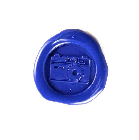 Brass wax seal with symbol design, featuring intricate engraved details for sealing letters or documents, by Papier Plume.