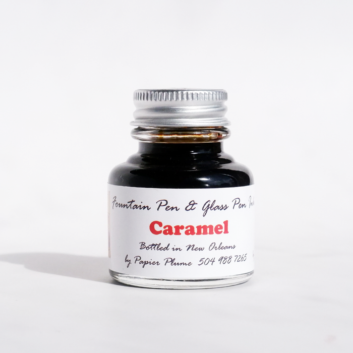 Papier Plume fountain pen ink in caramel color, bottle of rich, smooth ink for writing and calligraphy.