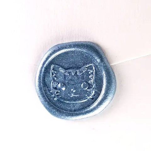 Brass wax seal stamp featuring a detailed cat face design, used for sealing documents or adding decorative touches.