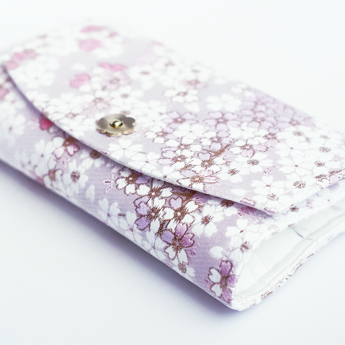 Cathay iridescent bloom pen case with a shiny, colorful floral design and zipper closure, perfect for storing pens and stationery.
