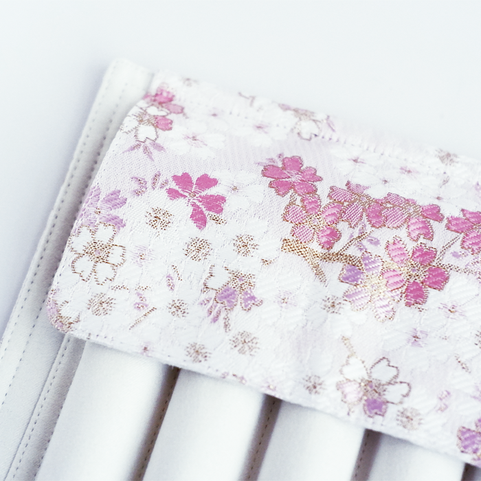 Cathay Snowlit Bloom pen case with floral pattern, compact design, and zipper closure, made of durable material.