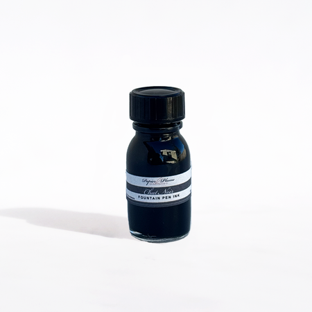 Papier Plume Chat Noir fountain pen ink bottle with black ink, featuring elegant labeling and classic design.