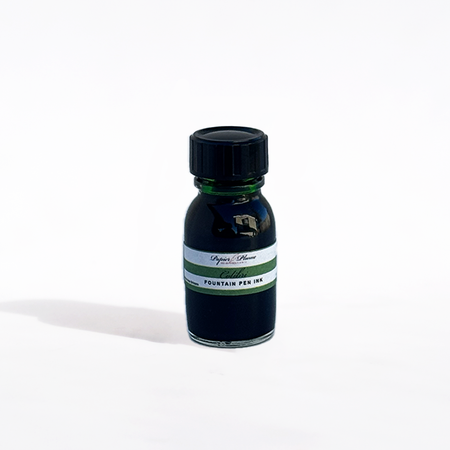 Bottle of Papier Plume Colibri fountain pen ink with a clear glass container and colorful ink inside.