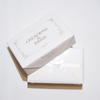 Rossi flat deckled edge stationery set with lined envelopes, featuring elegant white cards for writing or special occasions.