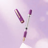 Nahvalur Original PLUS fountain pen with black resin body and gold accents, showcasing its elegant design and fine nib.