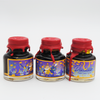 Papier Plume Doubloon shimmer fountain pen ink bottle with gold and blue accents on a white background.