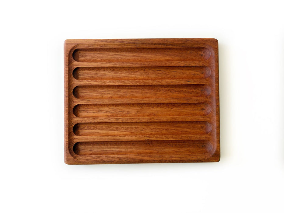 Eng Leather Co. wooden pen tray with compartments, designed for organizing pens and stationery on a desk.