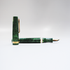 Gioia Metis 2.0 emerald green fountain pen with sleek design and gold accents on the cap and clip.