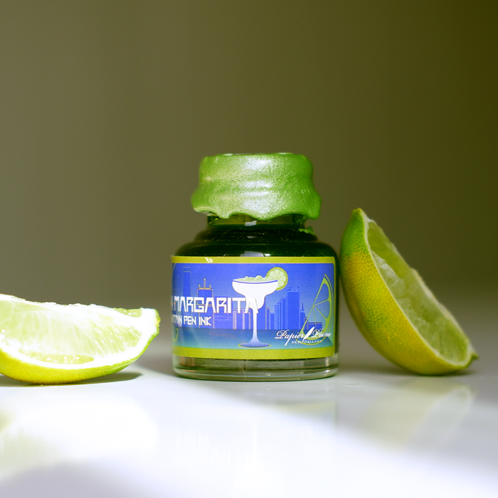 Papier Plume Frozen Margarita shimmer fountain pen ink in a bottle, showcasing vibrant, shimmering blue and green ink for fountain pens.