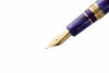 Esterbrook The Rockstar Estie fountain pen with a sleek black finish and gold accents, shown with its cap removed.