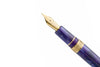 Esterbrook The Rockstar Estie fountain pen with black resin body and gold accents, displayed on a white background.