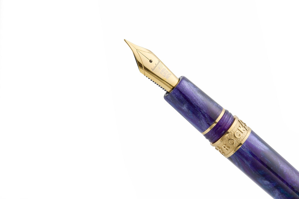 Esterbrook The Rockstar Estie fountain pen with black resin body and gold accents, displayed on a white background.