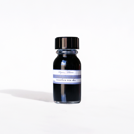 Papier Plume Halcyon Days fountain pen ink in a 15ml glass bottle with a black cap, vibrant ink color visible in the image.