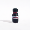 Papier Plume fountain pen ink bottle with hibiscus-colored ink in a clear glass container.