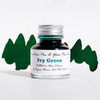 Bottle of Papier Plume Ivy Green fountain pen ink with a clear label and green ink visible inside.
