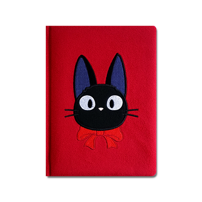 Red notebook with a black cat illustration on a white background