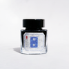 Bottle of Cathay Kirin fountain pen ink with a clear glass container and black ink inside.