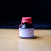 Papier Plume The Loop Series fountain pen ink in purple, featuring a sleek ink bottle with a modern label.