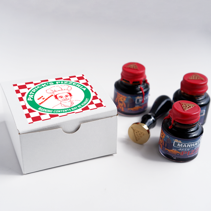 Papier Plume Manhattan Man-Eating Pizza fountain pen ink set with colorful ink bottles and packaging for fountain pen enthusiasts.