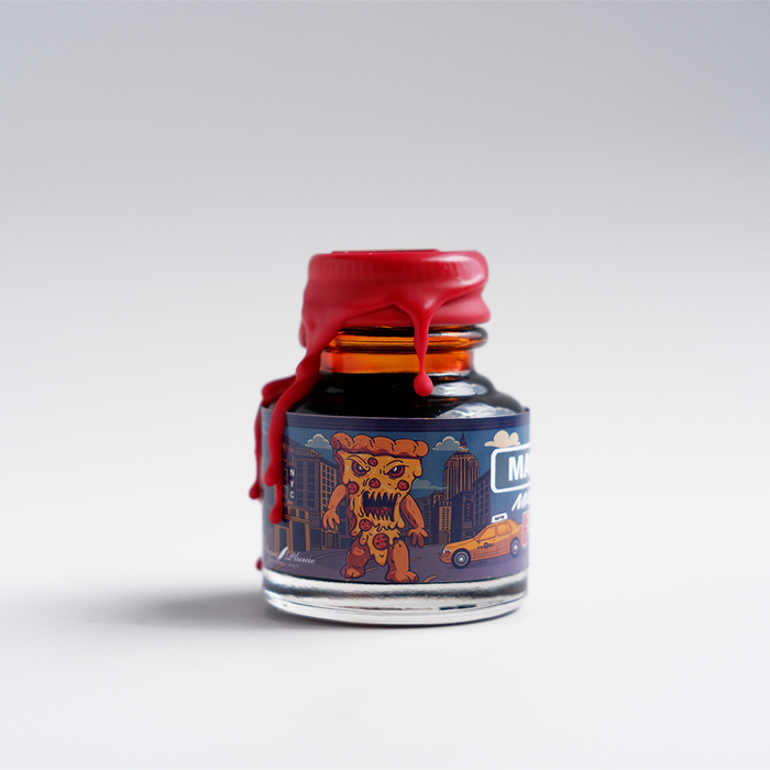 Papier Plume Manhattan Man-Eating Pizza fountain pen ink set with colorful ink bottles on a white background.
