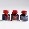 Papier Plume Manhattan Man-Eating Pizza fountain pen ink set with colorful ink bottles for writing and artistic use.