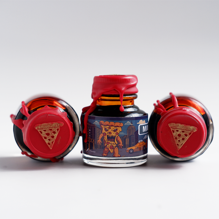 Papier Plume Manhattan Man-Eating Pizza fountain pen ink set with colorful ink bottles and packaging design.