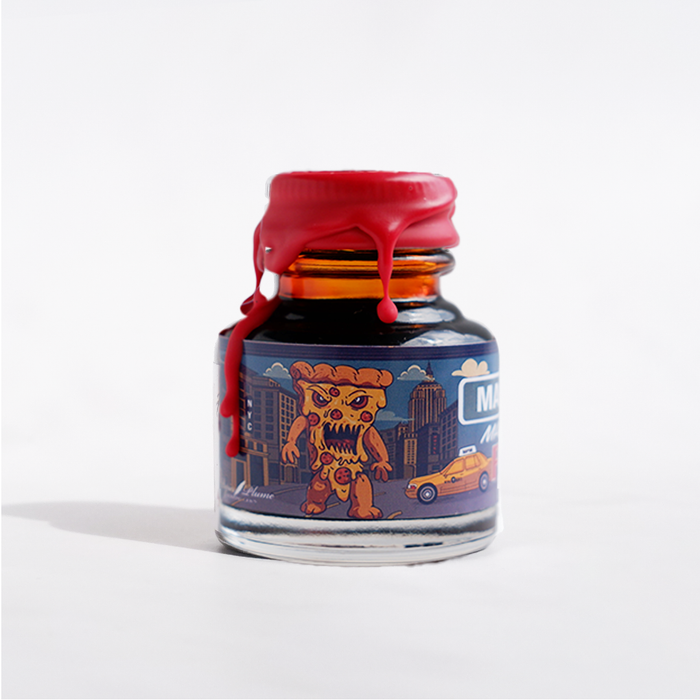 Papier Plume Manhattan Man-Eating Pizza fountain pen ink bottle with colorful label and ink inside, perfect for writing and calligraphy.