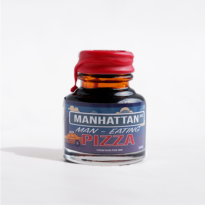 Papier Plume Manhattan Man-Eating Pizza fountain pen ink in a bottle, featuring vibrant pink color and creative pizza-themed label.